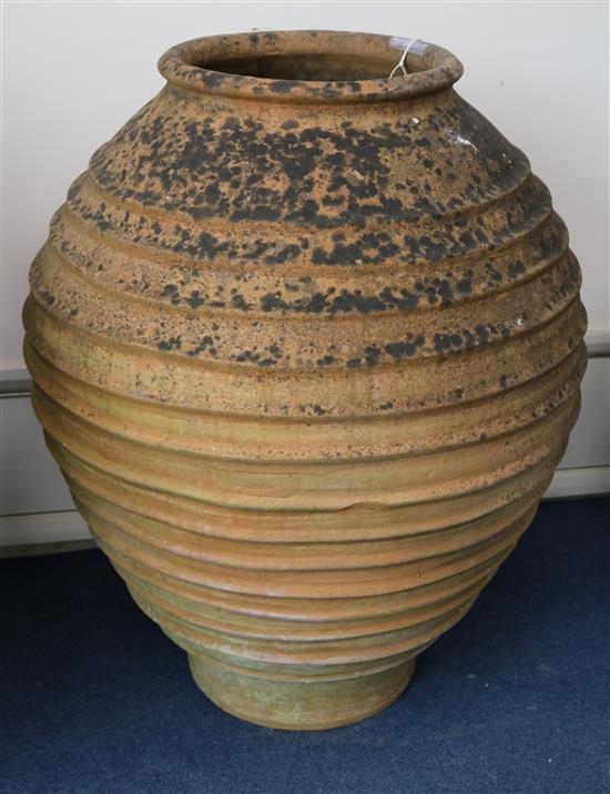 A terracotta pot with banded decoration, H.100cm